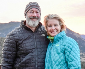 Jim-and-Sara A warm photo of the business founders, Jim LaMance and Sara Sharpe LaMance, outdoors with a mountain backdrop at sunset.